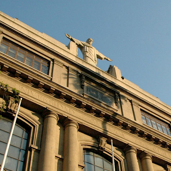 The statue of Christ at the front of the building was made in 1935 by the Hungarian sculptor Ernest Wünsch. It is 5 meters tall and 5.5 meters wide, and it is inspired by Christ the Redeemer.