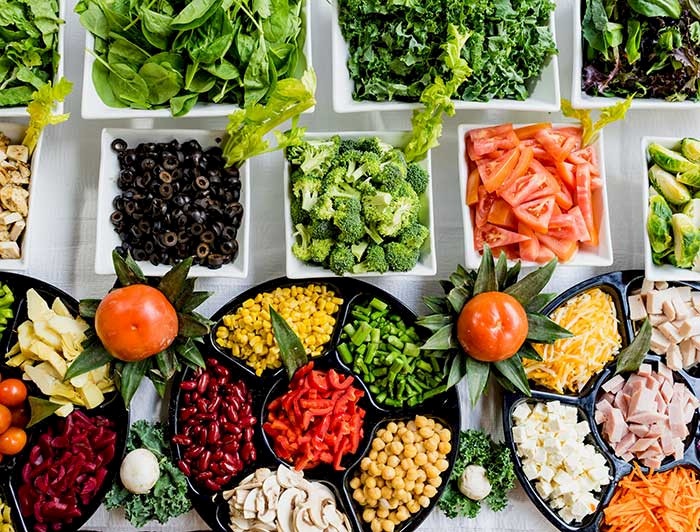 Trays with food of all colors.