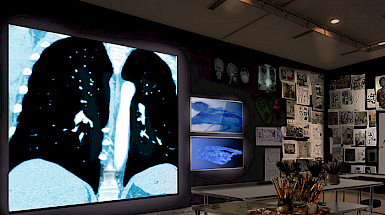 a room with a large black and white photograph on the wall