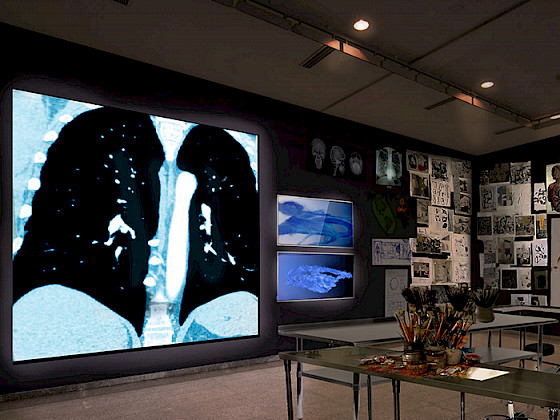 a room with a large black and white photograph on the wall