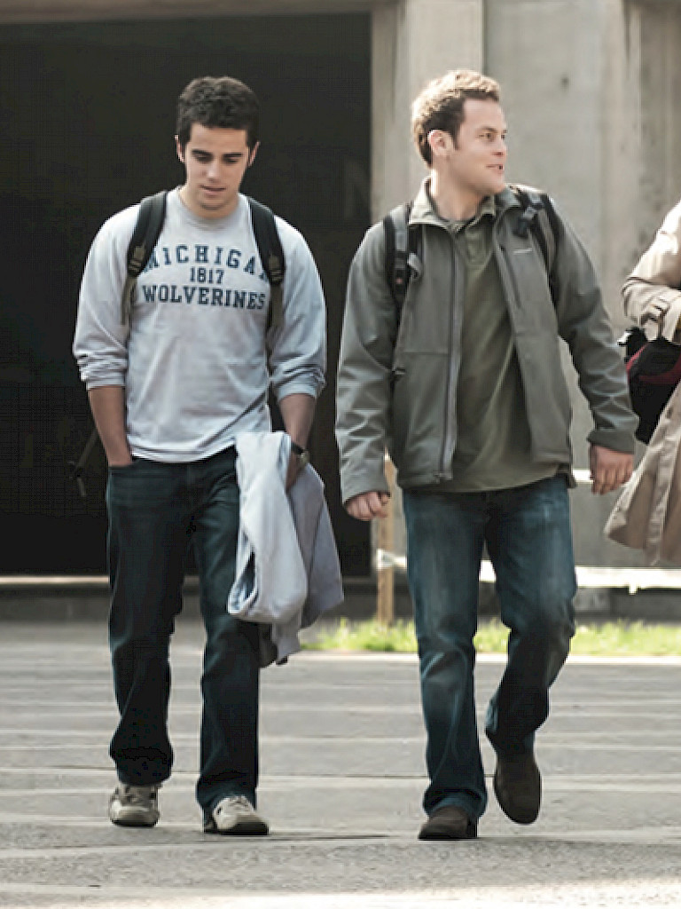 Four international students walk through the San Joaquin campus.