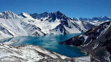 Lake in the middle of snow-capped mountains