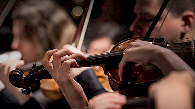 Hands playing a violin