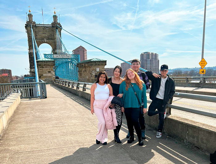 The group of students in a bridge of New York.