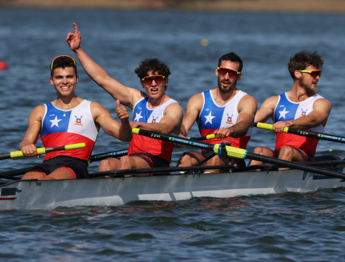 Nahuel Reyes along with other competitors on a canoe.