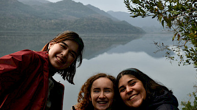Students from UC Chile and Duke smiling, the Huilo Huilo Biological Reserve can be seen in the background.