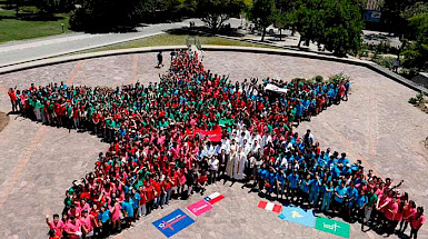 A group of volunteers forming a human star