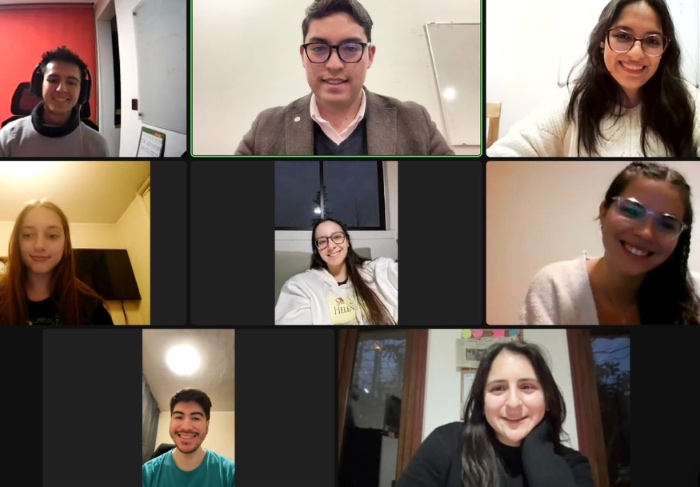 Screenshot of a zoom meeting featuring the eight UC Chile participants of the UN's Millennium Fellowship program.