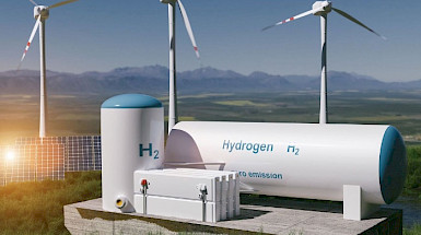 Green hydrogen cylinders next to wind energy generators and solar panels.