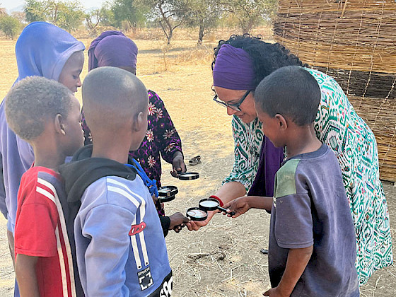 A teacher teaching children in Chad