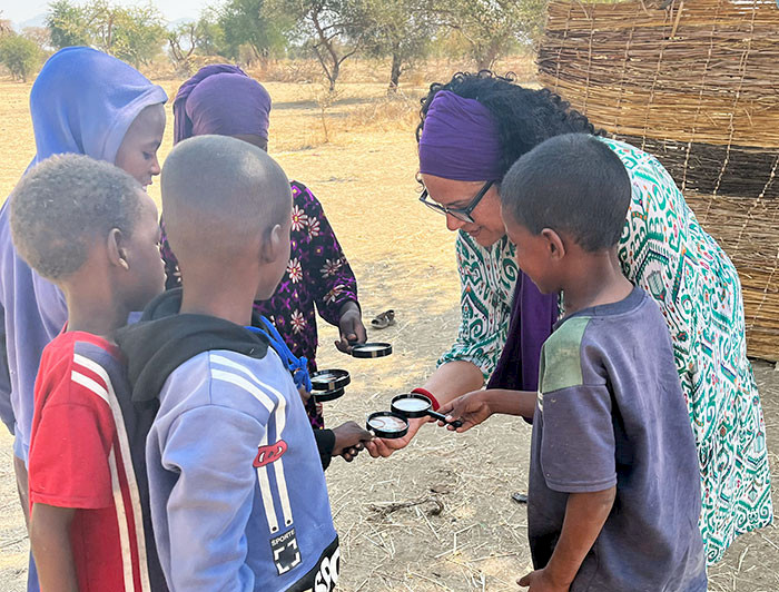 A teacher teaching children in Chad