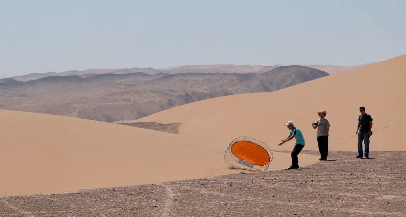 Researchers testing the rover in the dunes