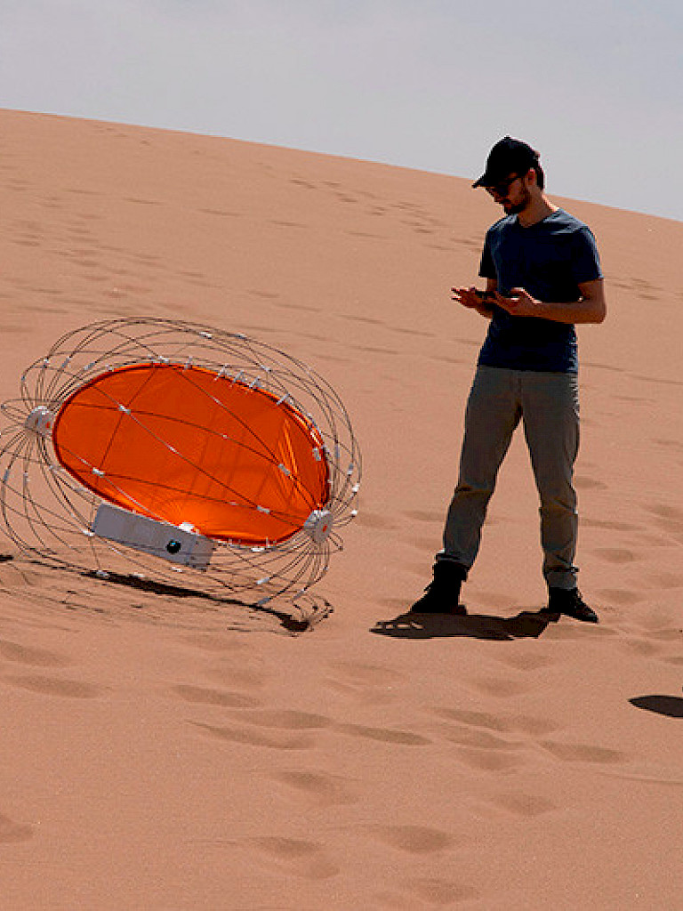 Researchers testing the rover in the dunes