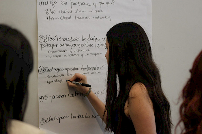 A student writing down an idea