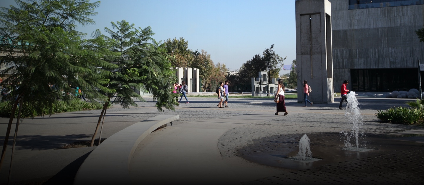 A group of students walk in the entrance of the San Joaquin campus.